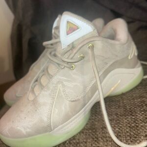 LeBron James basketball shoes 
Stylish Beige Sneakers with Green Soles